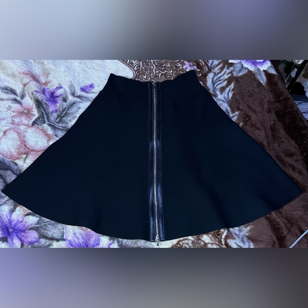 A.L.C black flare skirt with leather trimmed double front zipper. Size Small.